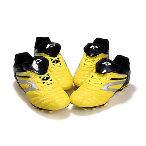 Chaussures de football jaunes pour enfants pour l'entraînement professionnel sur gazon