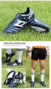 Detail view of kids turf soccer shoes with shock absorption sole and splash pattern