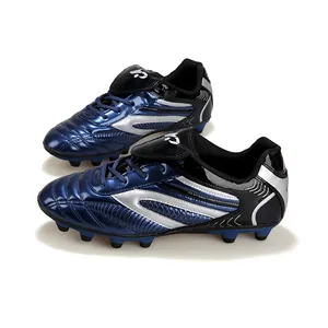 Crampons de football professionnels bleus et argentés pour enfants avec fini métal
