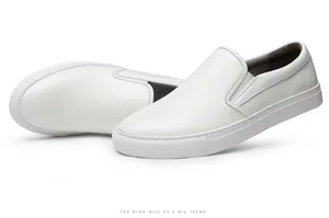 Detailed side view of premium men's white pebbled leather slip-on casual loafers