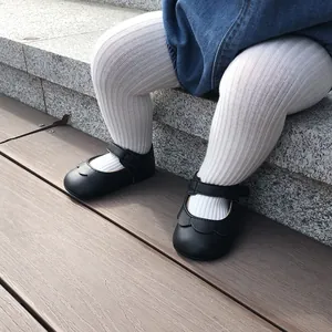 Close-up view of black PU leather baby princess walker shoes with soft soles