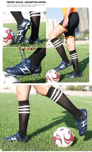 Detailed action shots of professional children's football cleats for kids on a grass field