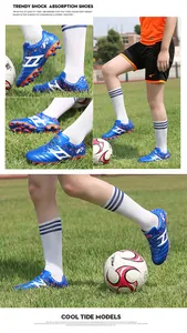 Professional blue children's soccer shoes with shock absorption for turf fields.