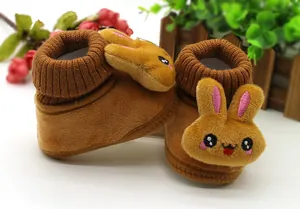 Close-up of cute brown rabbit cartoon baby winter walker shoes with plush texture