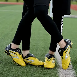 Chaussures de football enfant jaunes professionnelles pour l'entraînement sur herbe