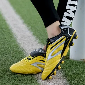 Crampons de football professionnels pour garçons en jaune et noir pour terrain en herbe