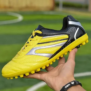 Chaussures de football professionnelles jaune et noir pour enfants avec crampons TF de turf