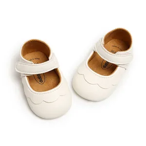 Detailed overhead view of white PU leather baby girl Mary Jane style princess shoes