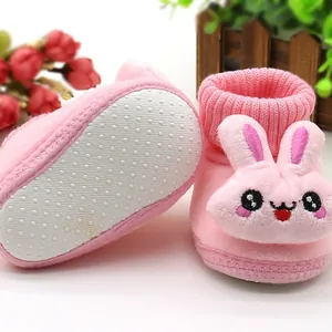 Soft pink winter baby shoes with cute 3D cartoon rabbit design and non-slip rubber sole