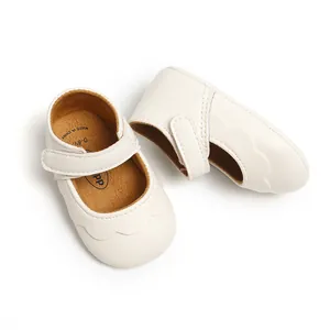 Top view of white PU leather baby Mary Jane shoes with scalloped edges and soft soles