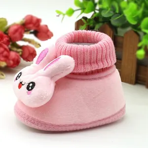 Soft pink plush baby walker shoe featuring a cute 3D bunny face and elastic ribbed ankle cuff