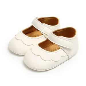 Elegant white PU leather baby walking shoes featuring a scalloped edge princess design
