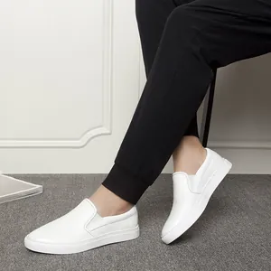 Minimalist white leather slip-on loafers for men in casual lifestyle setting