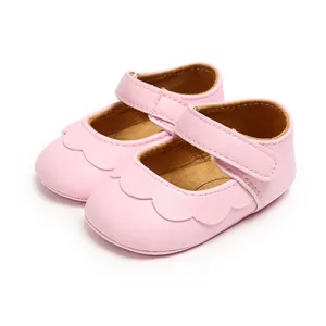 Detailed view of pink scalloped baby girl PU leather princess walking shoes.