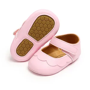 Soft pink baby princess walking shoes with scalloped edges and non-slip honeycomb rubber soles