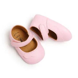 Top view detail of pink PU leather baby Mary Jane shoes with soft flexible soles.