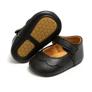 Close-up detail of black baby princess shoes featuring honeycomb non-slip soft sole
