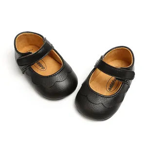 Detailed top view of black PU baby Mary Jane shoes with scalloped edges