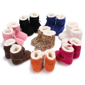 Detailed view of colorful baby winter snow boots with fleece lining and fringe detail
