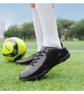 Scarpe da calcio professionali nere per bambini per campi in erba sintetica outdoor