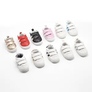 Variety of colorful baby walking sneakers with non-slip rubber soles and velcro straps.