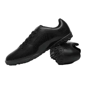 Scarpe da calcio professionali nere per bambini con suola turf per l'allenamento
