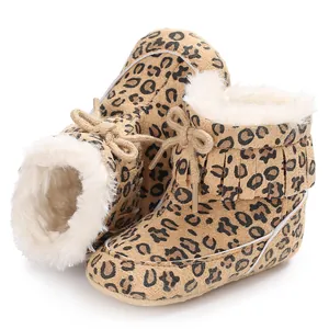 Warm leopard print baby snow boots featuring soft faux fur lining and fringe details.