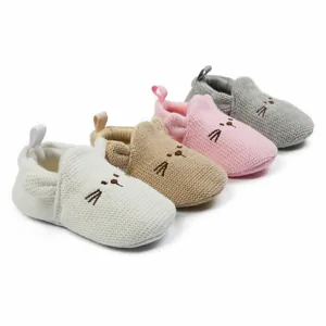 Soft knitted infant walking shoes with cartoon cat ears shown in multiple colors