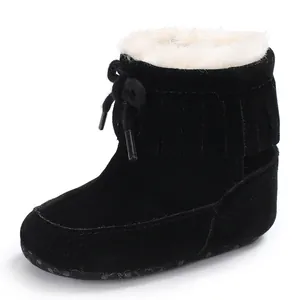Infant black winter snow boots featuring cozy white faux fur lining and stylish fringe detail