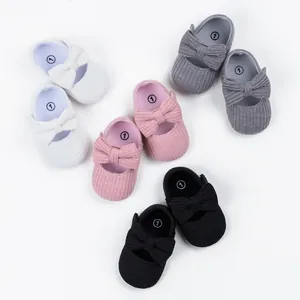 Soft ribbed baby princess walking shoes with bow decoration in four available colors.