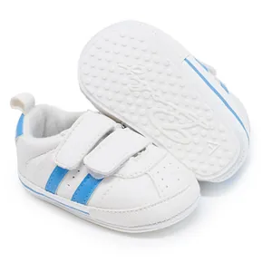 Close-up view of baby walking shoes featuring dual straps and a non-slip rubber sole