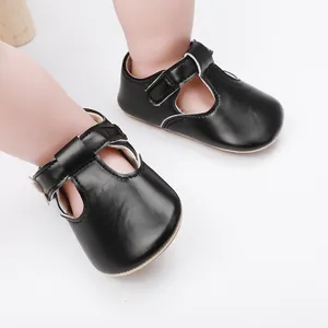 Close-up view of black baby girl Mary Jane shoes with T-strap and soft indoor sole