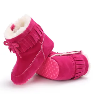 Fuchsia pink baby winter snow boots with warm faux fur lining and fringe detail