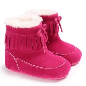 Rose pink baby winter snow boots featuring stylish fringes and warm white fur lining