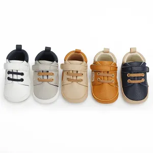 Detail view of five different colored faux leather baby walking shoes for 0-1 year olds