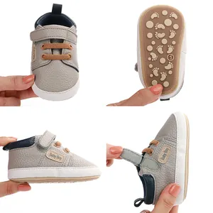 Detailed views of grey faux leather baby boy walking shoes with non-slip soles