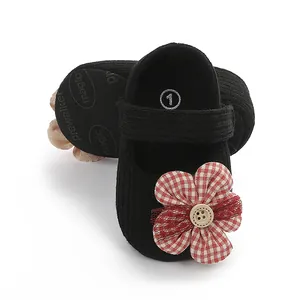 Soft-sole infant walker princess shoes in black with red checkered flower detail