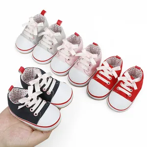 Soft-soled canvas pre-walker sneakers for 0-1 year old baby girls in multiple colors.