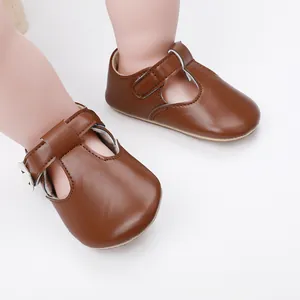 Detailed view of brown baby princess shoes with T-strap design and soft velcro closure