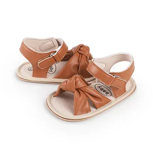 Brown baby walker sandals with soft soles and decorative bow knot detail