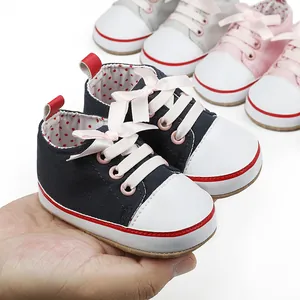 Navy blue baby soft-sole pre-walker sneakers with pink ribbon laces for 0-12 months babies