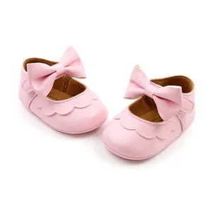 Close-up of pink baby girl princess shoes with soft PU leather and bow detail