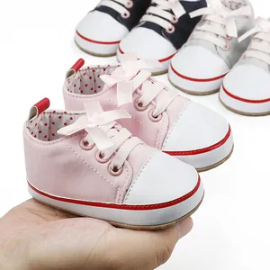 Close-up of soft-soled infant pre-walker shoes in multiple colors for 0-12 months.
