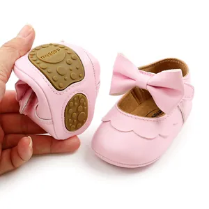 Pink PU leather baby princess shoes with a soft flexible sole and bow detail.