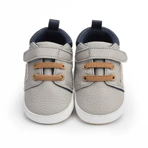Detailed front view of grey baby walker shoes for infants aged 0 to 12 months long.