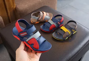 Close-up detail of colorful boys' summer beach sandals with secure hook-and-loop straps