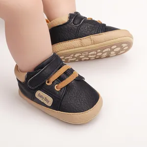 Close-up of navy baby walking shoes with soft soles, elastic laces and side tag