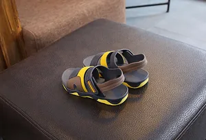 Casual boys' sport sandals featuring a trendy grey, brown, and yellow color-block design