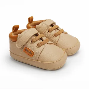 High-quality beige baby walking shoes with convenient velcro straps and Baby Boy label