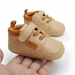 Comfortable beige baby walking shoes with Baby Boy patch and hook and loop strap